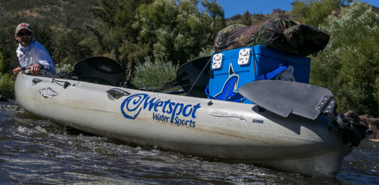 Hard Yards - Pulling the new Hobie Mirage Oasis through some rough rapids .